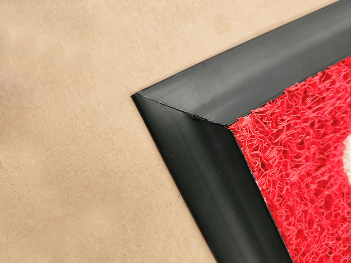 Beveled rubber edge on PVC coil mat